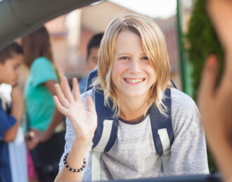 Mother dropping child off at school before going to car maintenance appointment